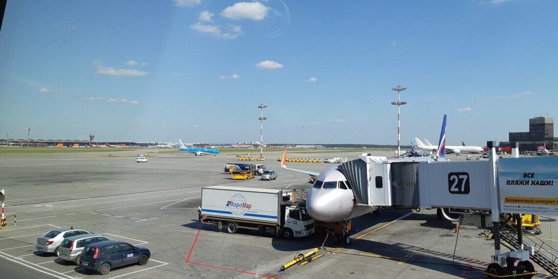 Aircraft at a gate on the apron at Moscow Sheremetyevo Airport, seen from Terminal D