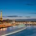 Eiffel Tower and Pont Alexandre III over the Seine in Paris at night