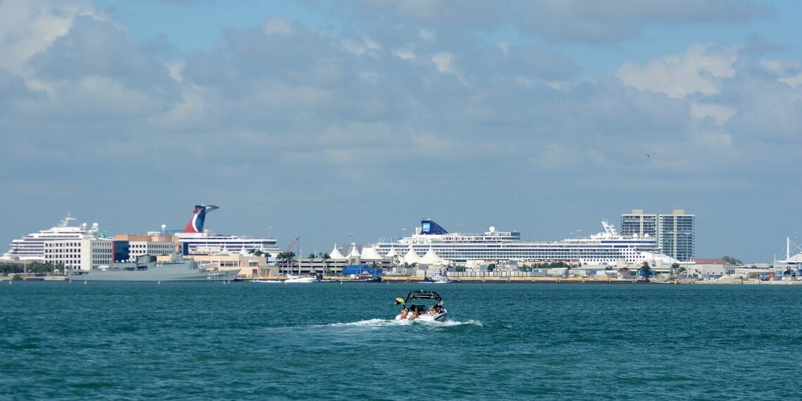 Cruise ships docked at the Port of Miami, seen across the water